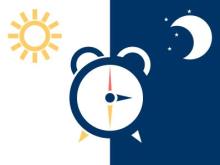 Imagen de un reloj con el sol al lado izquierdo que indica que es de día y la luna a la derecha que indica que es de noche. Imagen cortesía de iStock
